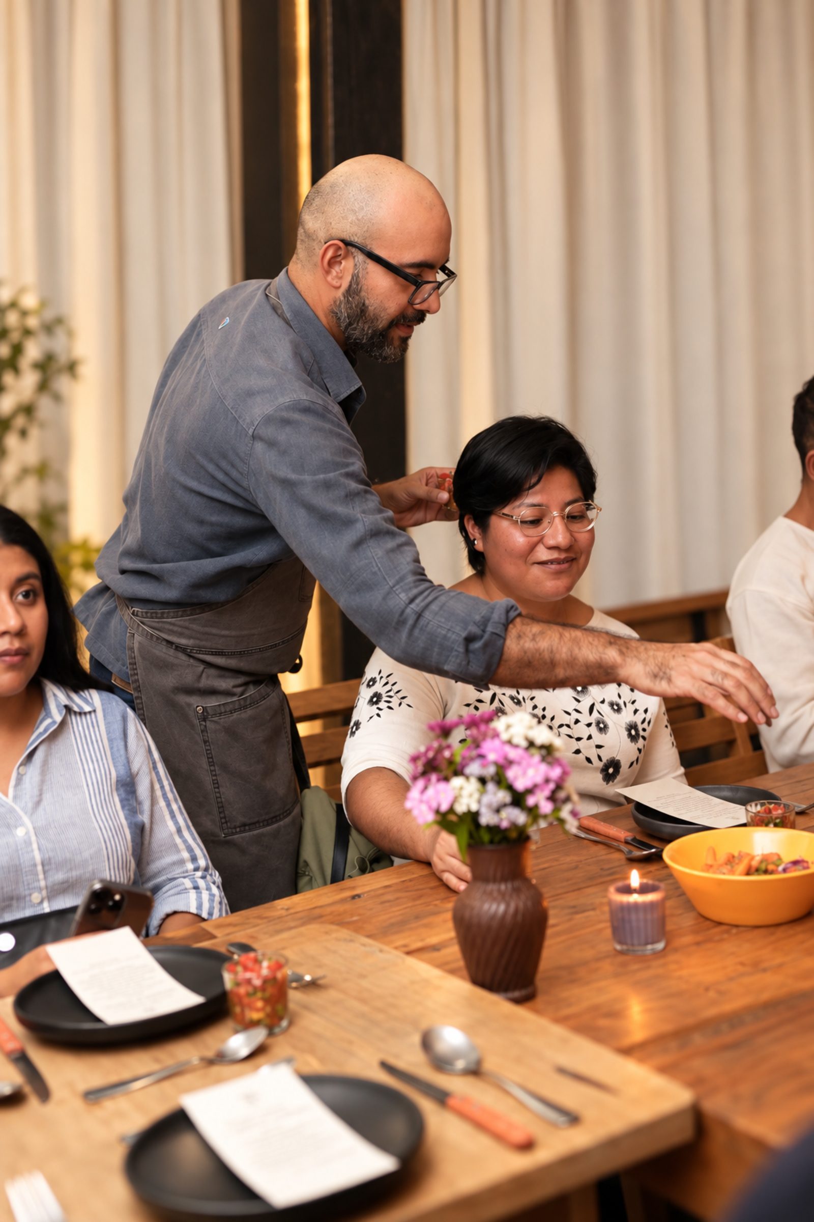 Frederick serving guests at a private dinner